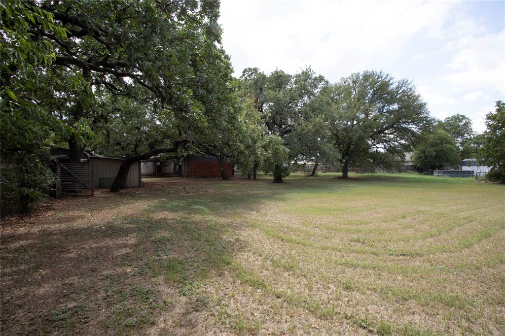 1311 Loving Highway Graham, TX 76450 - Photo 28 of 31 a view of a outdoor space with deck and trees