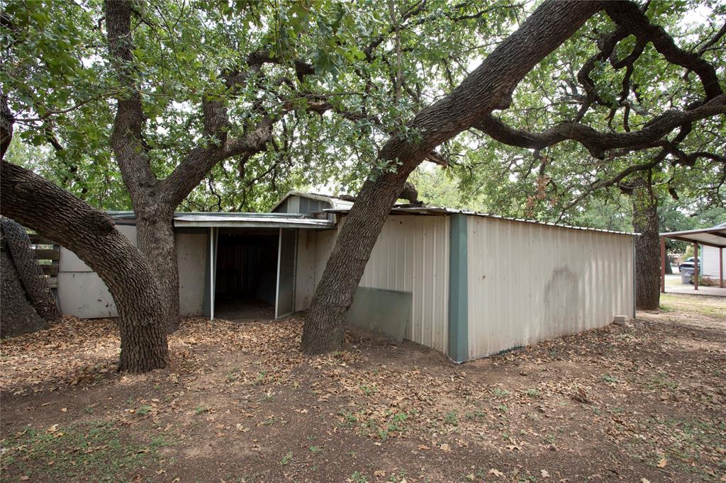 1311 Loving Highway Graham, TX 76450 - Photo 31 of 31 a view of a house with a tree