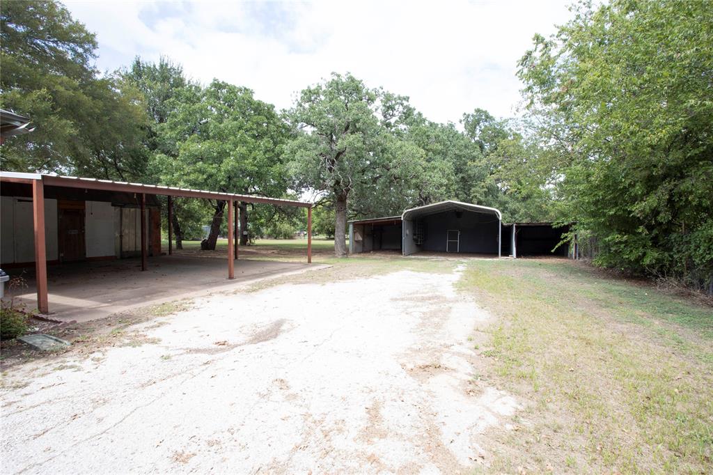 1311 Loving Highway Graham, TX 76450 - Photo 5 of 31 a backyard of a house with table and chairs