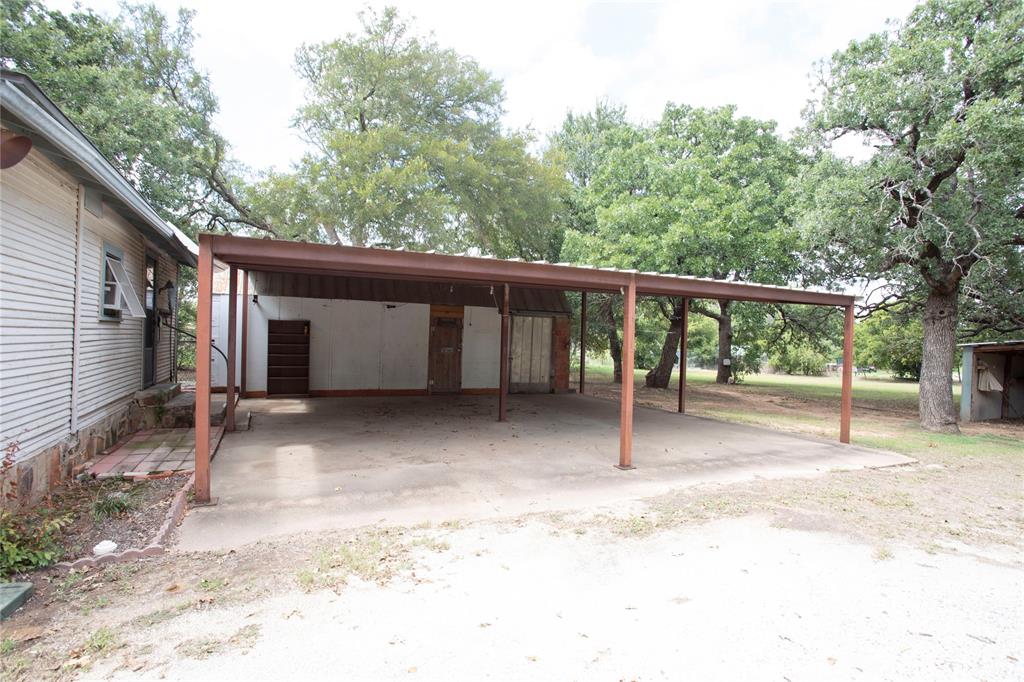 1311 Loving Highway Graham, TX 76450 - Photo 6 of 31 a view of a house with a backyard