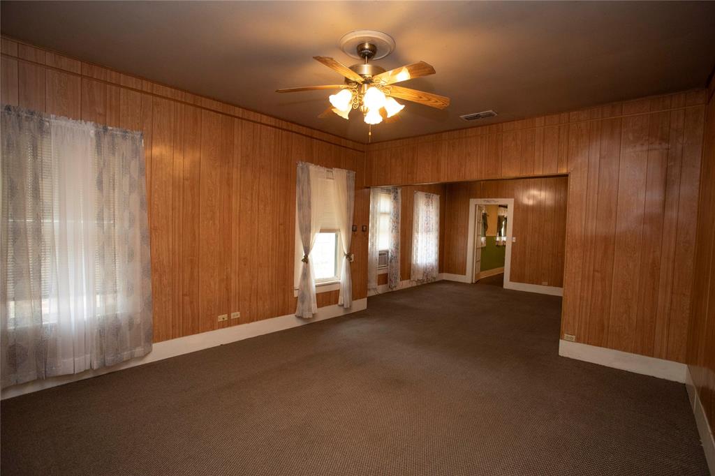 1311 Loving Highway Graham, TX 76450 - Photo 8 of 31 a view of a livingroom with a chandelier fan