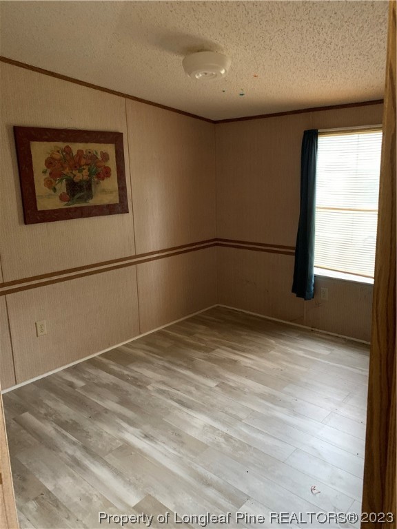 6400 Waldos Beach Road Fayetteville, NC 28306 - Photo 14 of 29 a view of a room with wooden floor and windows