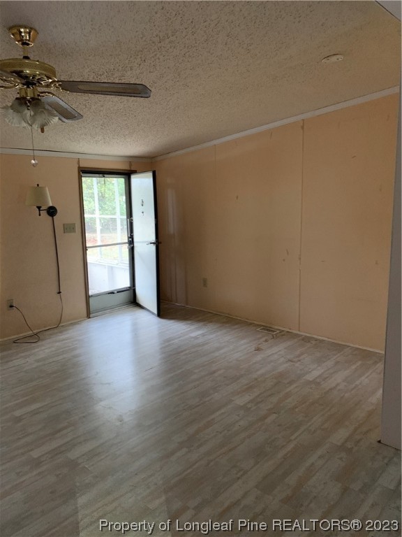 6400 Waldos Beach Road Fayetteville, NC 28306 - Photo 20 of 29 an empty room with wooden floor and windows