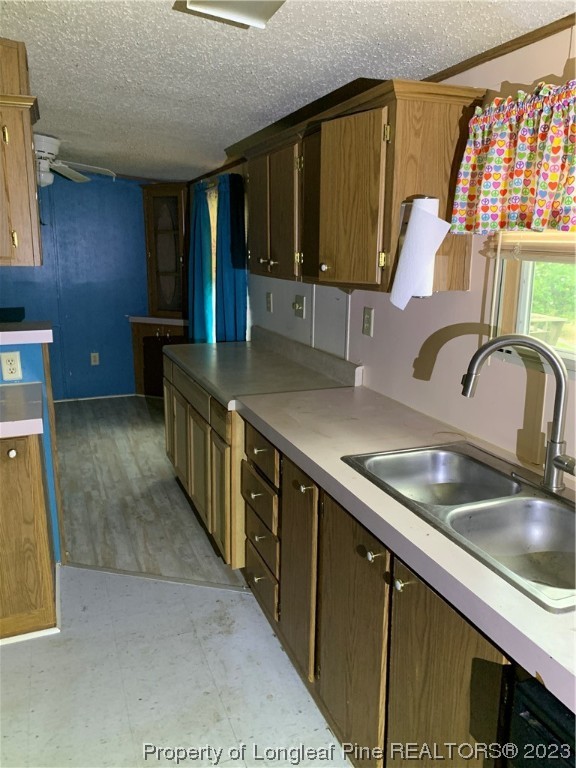 6400 Waldos Beach Road Fayetteville, NC 28306 - Photo 6 of 29 a kitchen with stainless steel appliances a sink and a cabinets