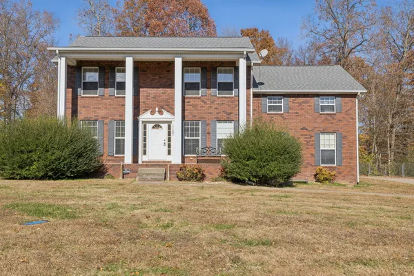 front view of a house with a yard