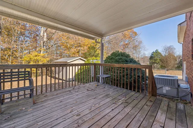 a view of balcony with wooden floor