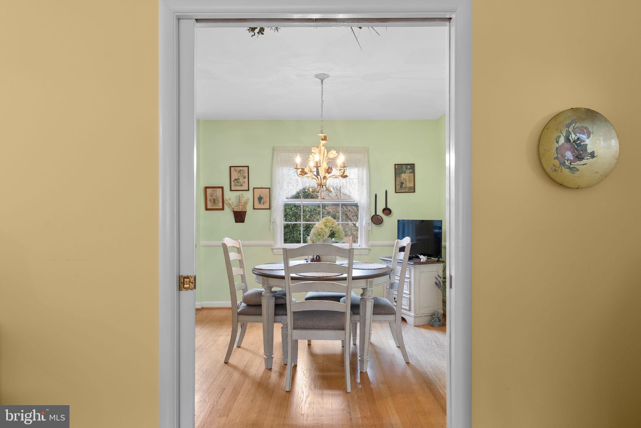 14004 Zeigler Way Silver Spring, MD 20904 - Photo 4 of 57 a view of a dining room with furniture and wooden floor