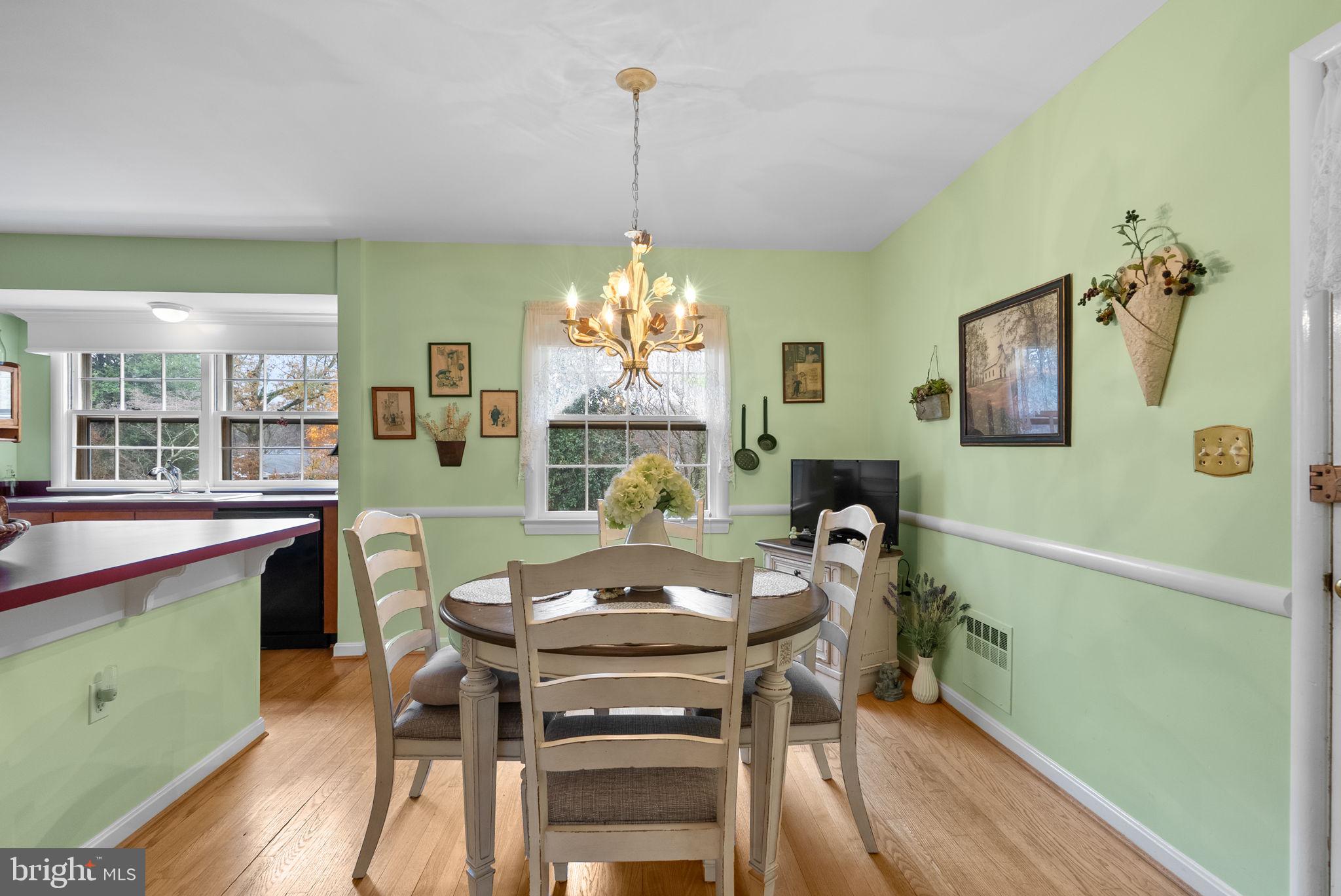 14004 Zeigler Way Silver Spring, MD 20904 - Photo 5 of 57 a view of a dining room with furniture window and wooden floor