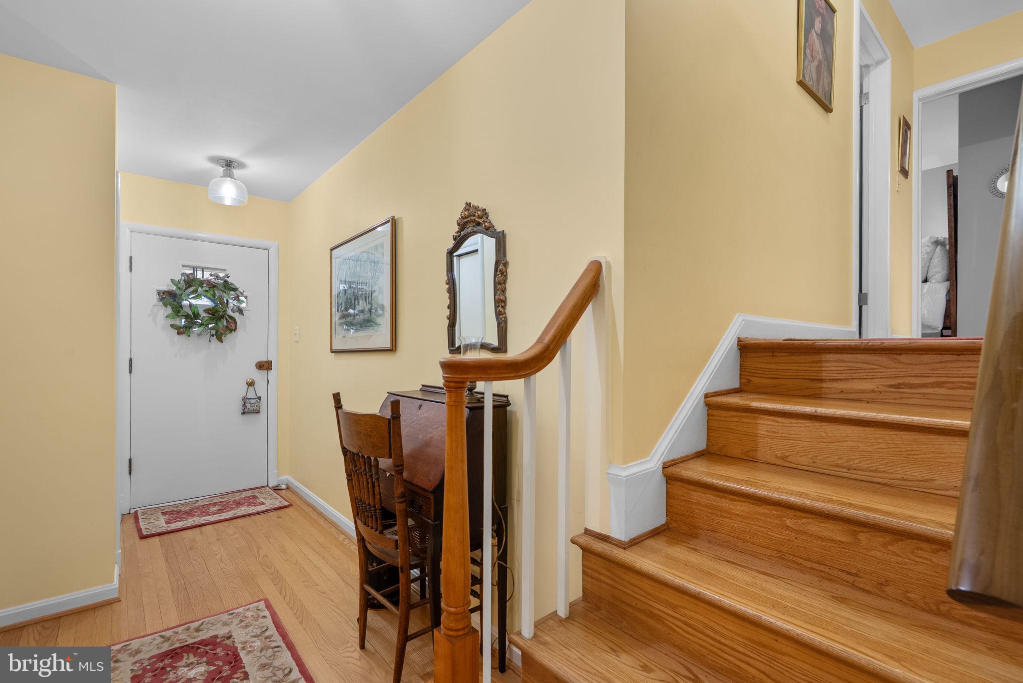 14004 Zeigler Way Silver Spring, MD 20904 - Photo 53 of 57 a view of an entryway with wooden floor and a chandelier