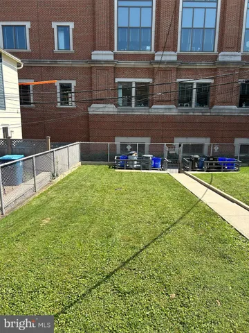 a view of a building with a yard