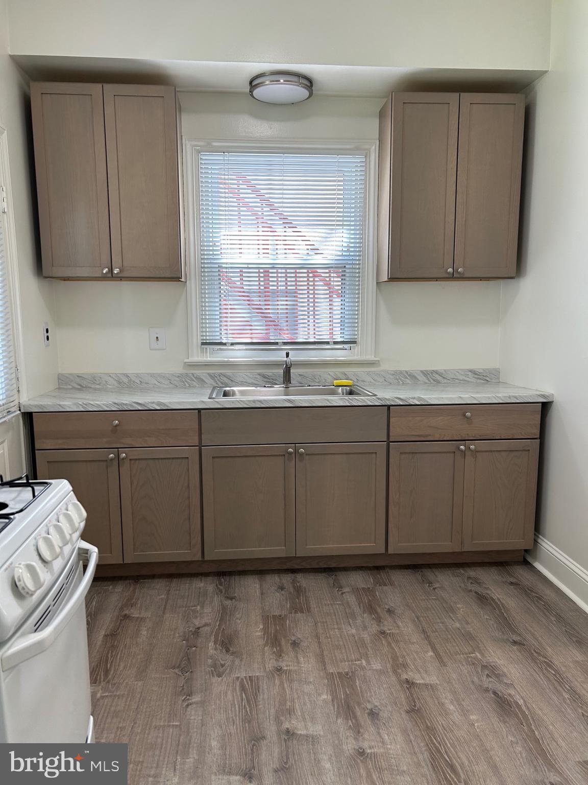 206 West Gay Street, Unit 1 West Chester, PA 19380 - Photo 3 of 14 a kitchen with sink cabinets and window
