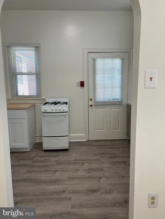 a view of a kitchen with a sink cabinets and a window