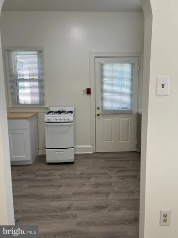 a view of a kitchen with a sink cabinets and a window