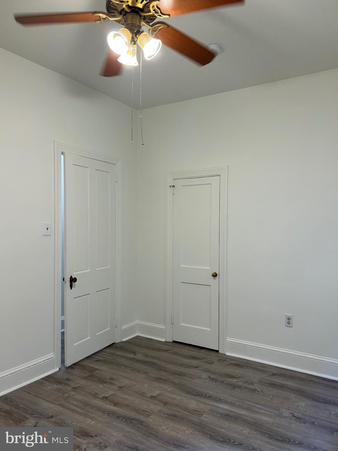 206 West Gay Street, Unit 1 West Chester, PA 19380 - Photo 6 of 14 an empty room with wooden floor closet and windows
