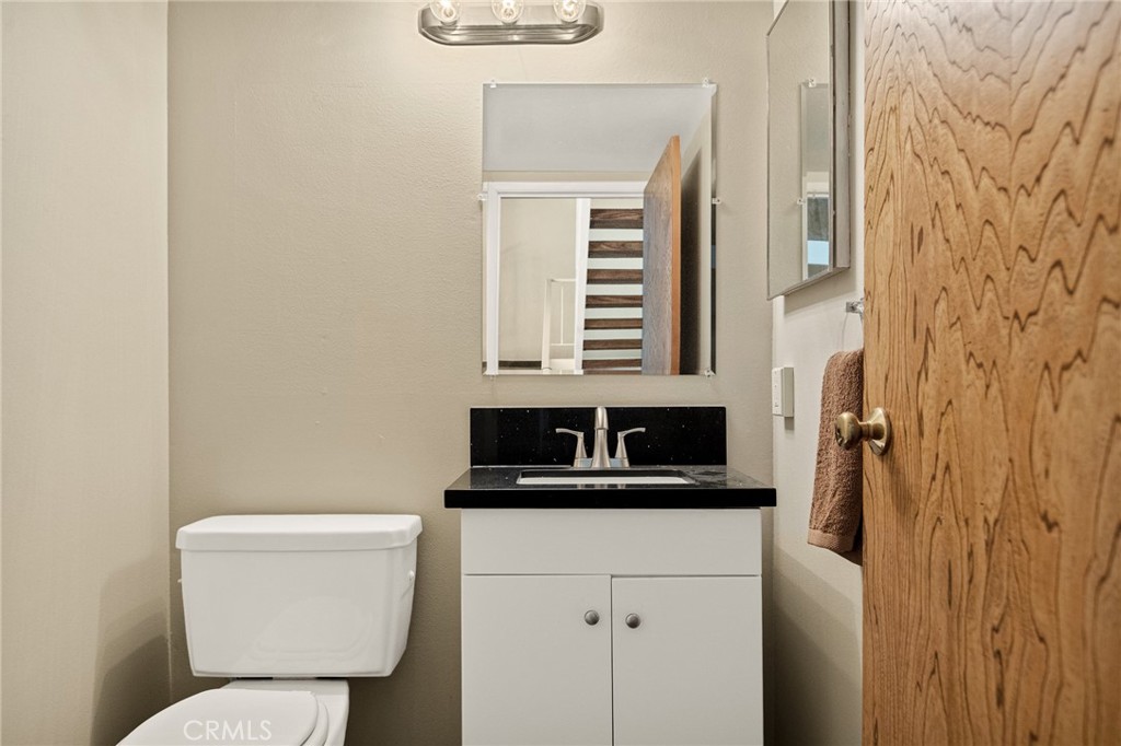966 Willow Creek Road, Unit 9 Lake Arrowhead, CA 92352 - Photo 11 of 27 a bathroom with a sink a toilet and a window