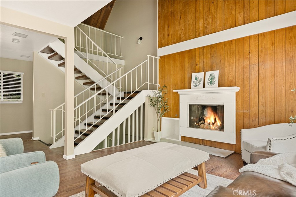 966 Willow Creek Road, Unit 9 Lake Arrowhead, CA 92352 - Photo 12 of 27 a living room with furniture and a fireplace