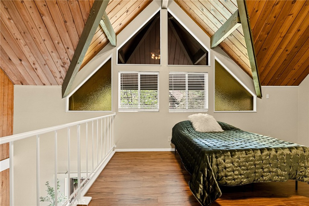 966 Willow Creek Road, Unit 9 Lake Arrowhead, CA 92352 - Photo 15 of 27 a front view of a house with wooden stairs