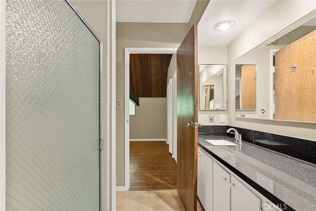 966 Willow Creek Road, Unit 9 Lake Arrowhead, CA 92352 - Photo 15 of 24 a bathroom with a sink and a mirror
