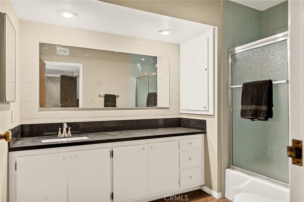 966 Willow Creek Road, Unit 9 Lake Arrowhead, CA 92352 - Photo 19 of 24 a bathroom with a sink and a mirror