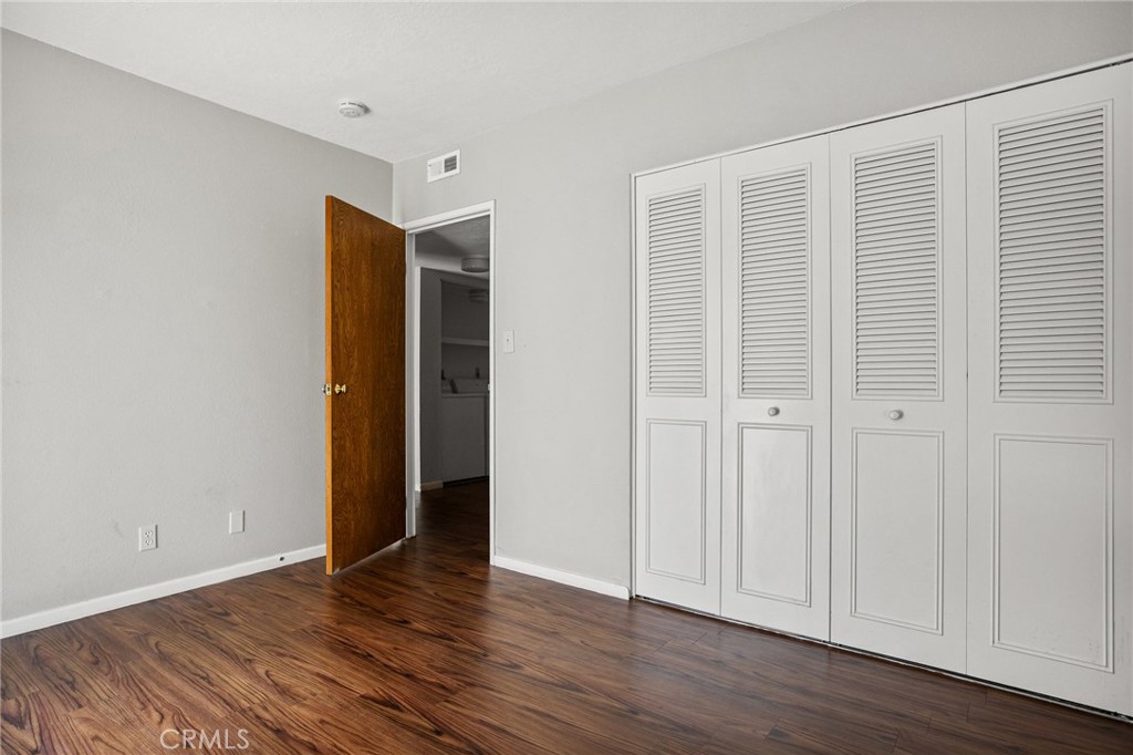 966 Willow Creek Road, Unit 9 Lake Arrowhead, CA 92352 - Photo 22 of 24 a view of an empty room with wooden floor