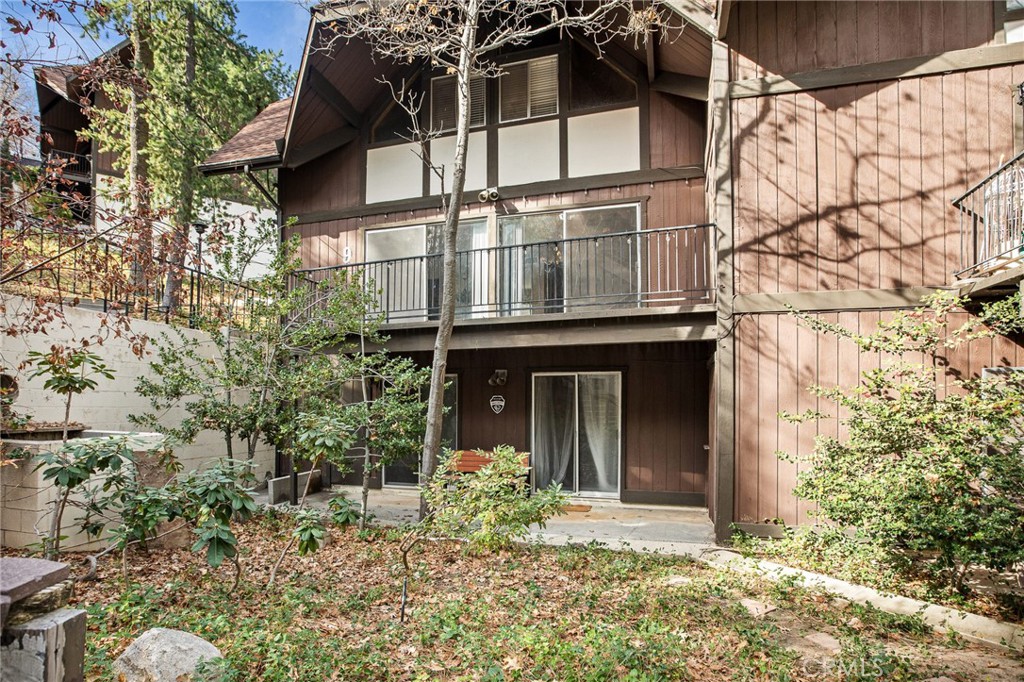966 Willow Creek Road, Unit 9 Lake Arrowhead, CA 92352 - Photo 23 of 24 a view of a house with a window and garden
