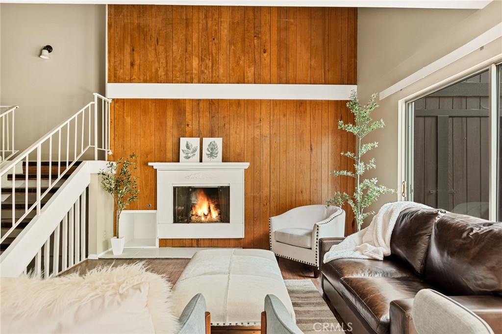 966 Willow Creek Road, Unit 9 Lake Arrowhead, CA 92352 - Photo 3 of 27 a living room with furniture and a fireplace