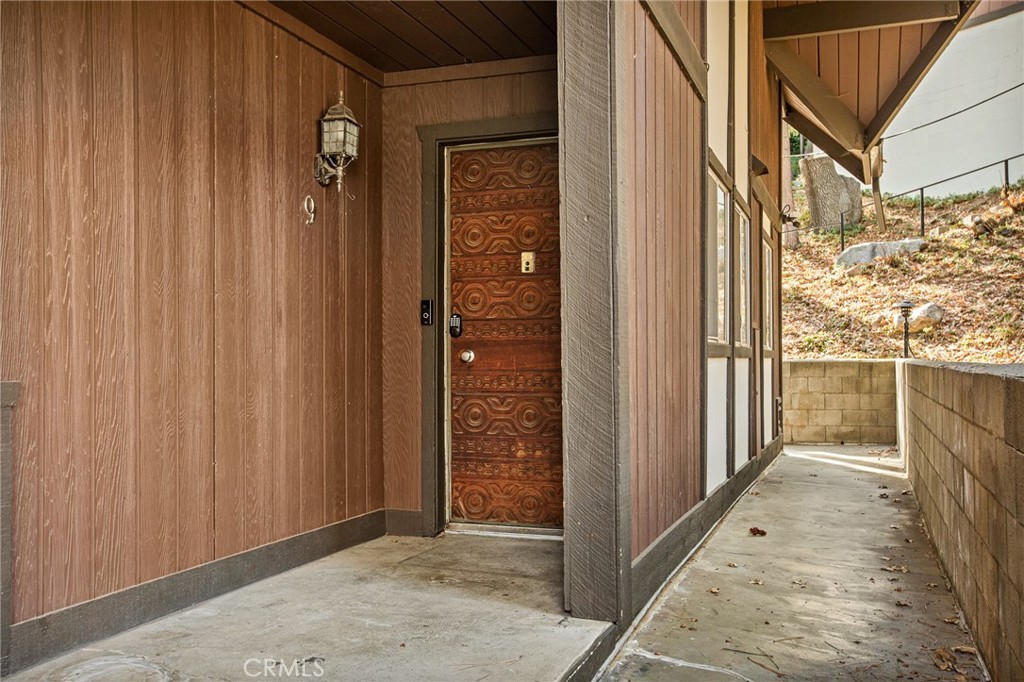 966 Willow Creek Road, Unit 9 Lake Arrowhead, CA 92352 - Photo 4 of 27 a view of a brick house with a door
