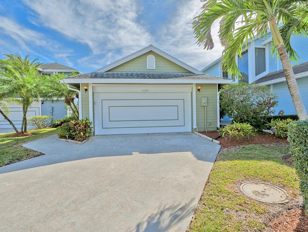 5124 Point Alexis Boca Raton, FL 33431 - Photo 1 of 21 a front view of a house with garden