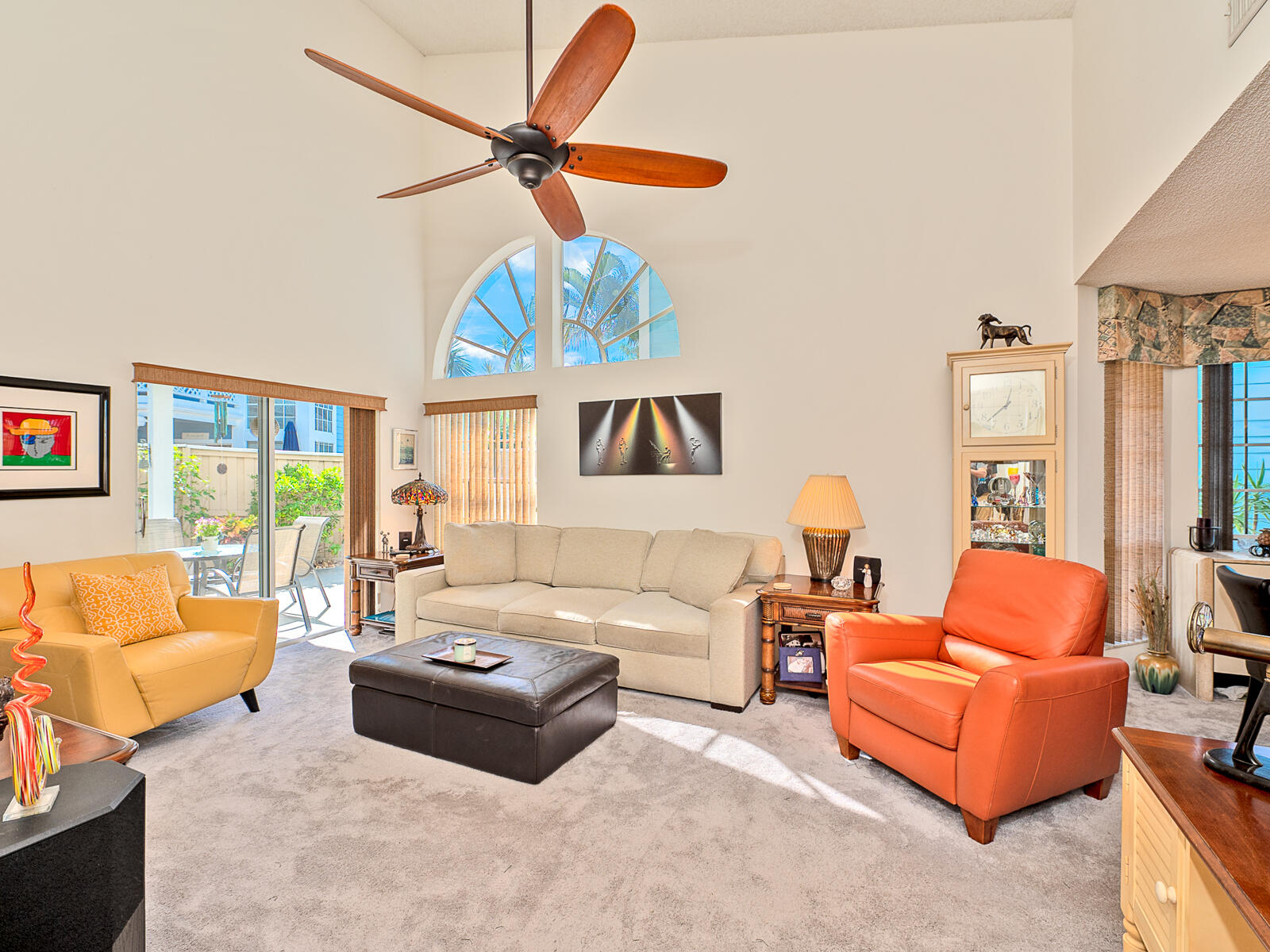 5124 Point Alexis Boca Raton, FL 33431 - Photo 2 of 21 a living room with furniture a ceiling fan and a window