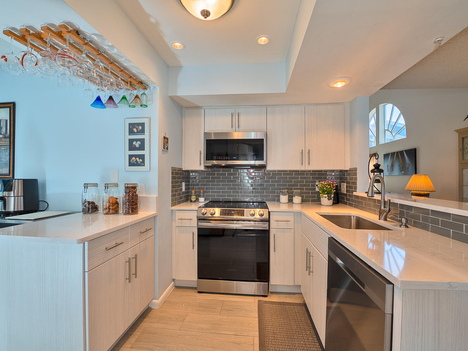 5124 Point Alexis Boca Raton, FL 33431 - Photo 6 of 21 a kitchen with a sink stove and microwave