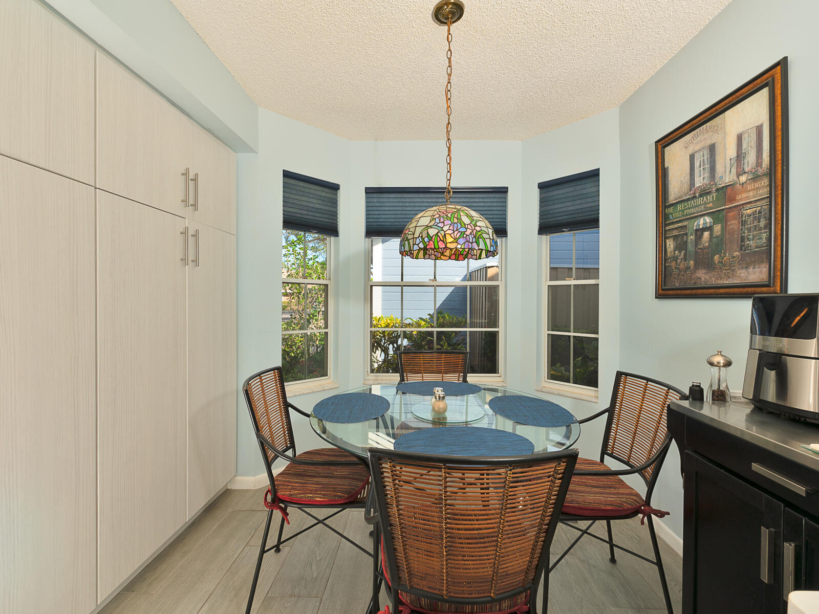 5124 Point Alexis Boca Raton, FL 33431 - Photo 8 of 21 a dining room with furniture a chandelier and wooden floor