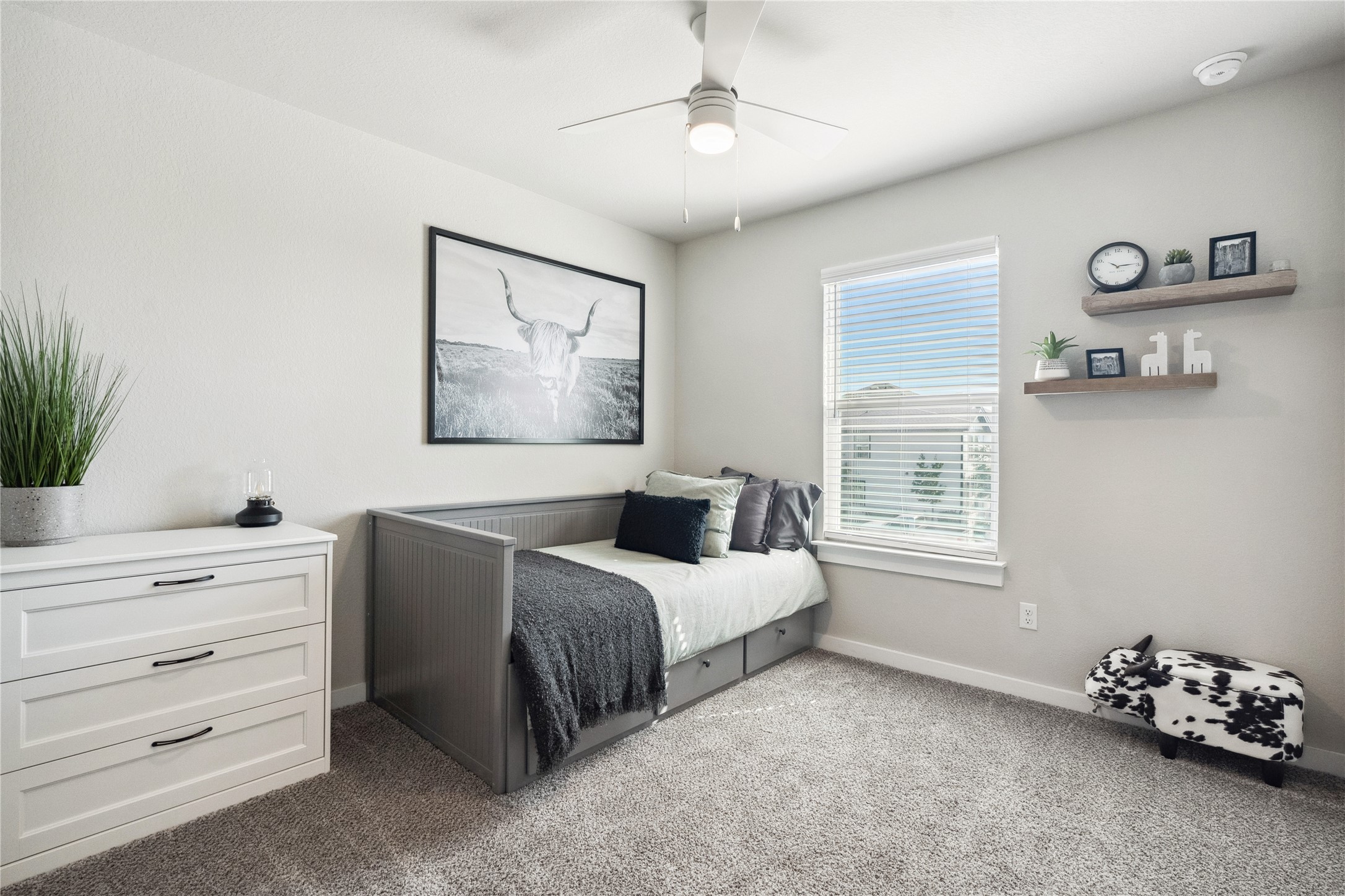 705 Apache Trail, Unit 511 Leander, TX 78641 - Photo 9 of 12 Bedroom with carpet, baseboards, and ceiling fan