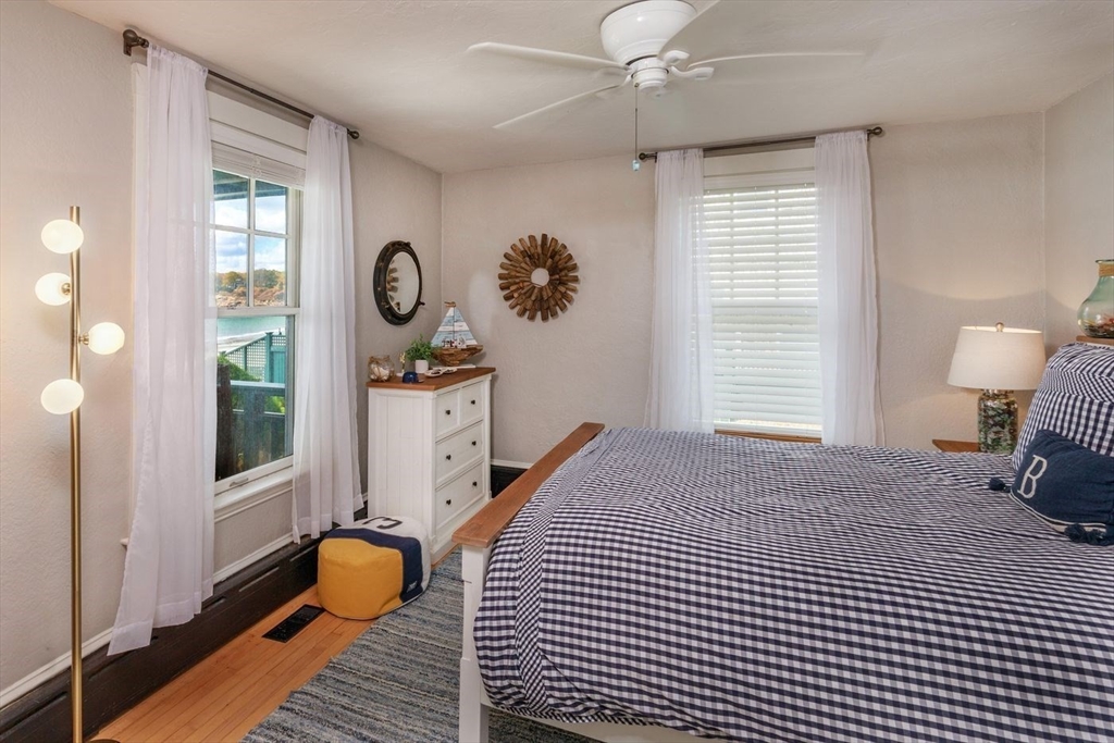 53 Raymond Street Manchester, MA 01944 - Photo 13 of 28 a bedroom with a bed a window and dresser
