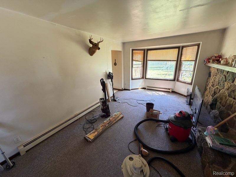 1643 North Nicholson Road Fowlerville, MI 48836 - Photo 17 of 17 Bay window, stone surround fireplace, baseboard heating
