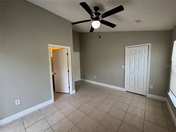 a kitchen with a refrigerator and a sink