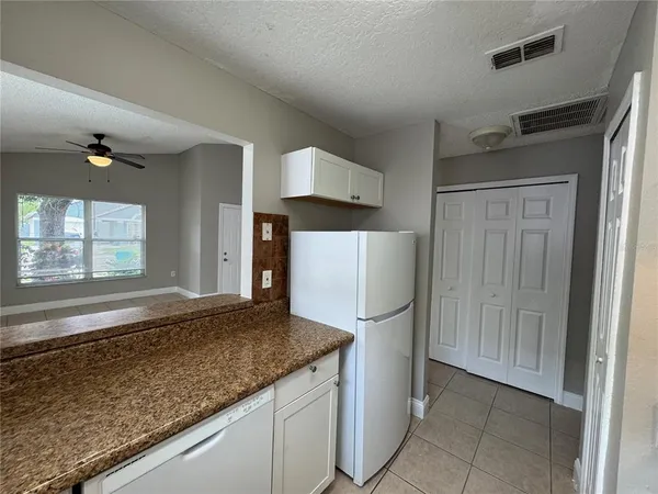 a kitchen with a sink a stove and refrigerator