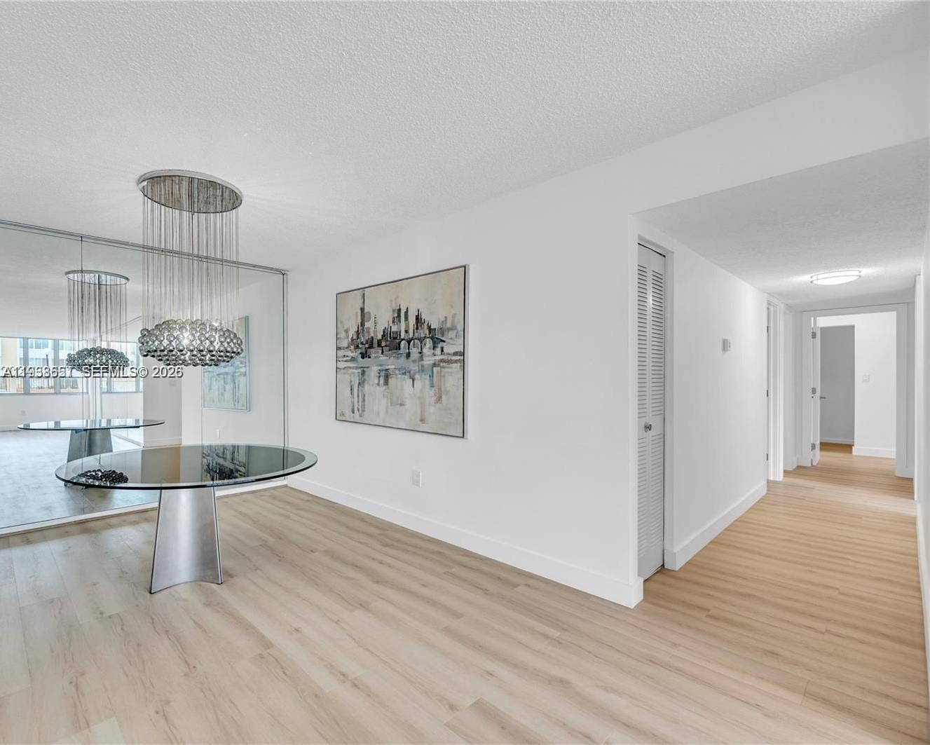 6861 Southwest 147th Avenue, Unit 1H Miami, FL 33193 - Photo 24 of 30 a view of empty room with wooden floor