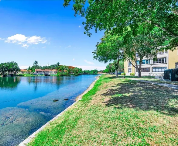 a view of a lake with houses in the back