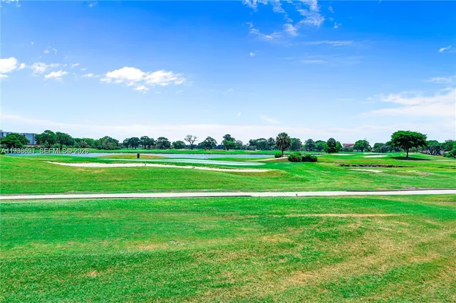 a view of a big yard with a big yard and plants