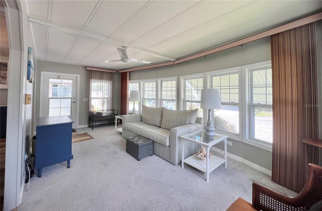 1100 South Belcher Road, Unit 657 Largo, FL 33771 - Photo 21 of 81 a living room with furniture and a large window