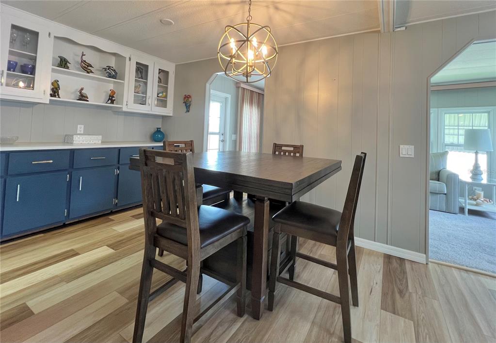 1100 South Belcher Road, Unit 657 Largo, FL 33771 - Photo 28 of 81 a view of a dining room with furniture and wooden floor