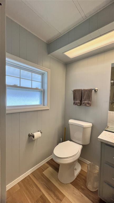 1100 South Belcher Road, Unit 657 Largo, FL 33771 - Photo 43 of 81 a white toilet sitting next to a bathroom sink and vanity