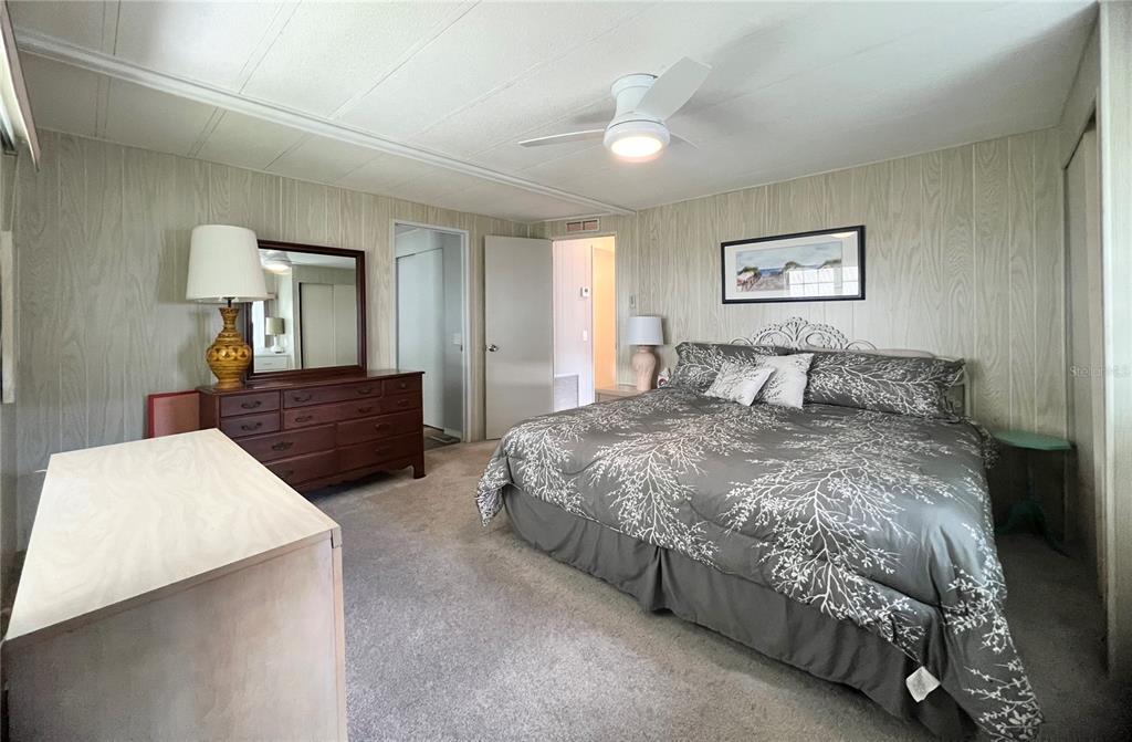 1100 South Belcher Road, Unit 657 Largo, FL 33771 - Photo 45 of 81 a bedroom with a bed and a dresser