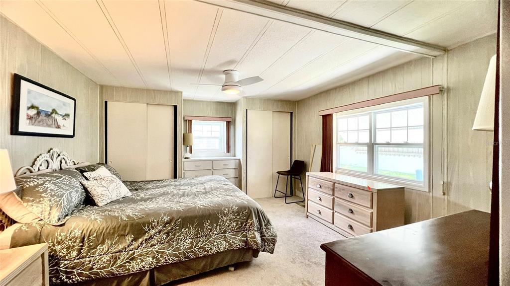 1100 South Belcher Road, Unit 657 Largo, FL 33771 - Photo 46 of 81 a bedroom with a large bed and a large window