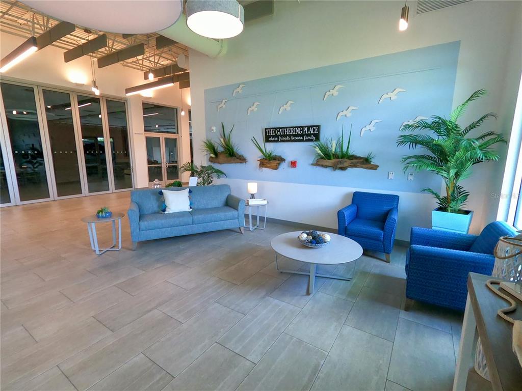 1100 South Belcher Road, Unit 657 Largo, FL 33771 - Photo 72 of 81 a living room with furniture and a potted plant