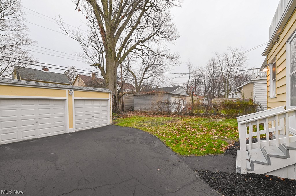 3379 Cedarbrook Road Cleveland, OH 44118 - Photo 30 of 31 View of yard with a garage
