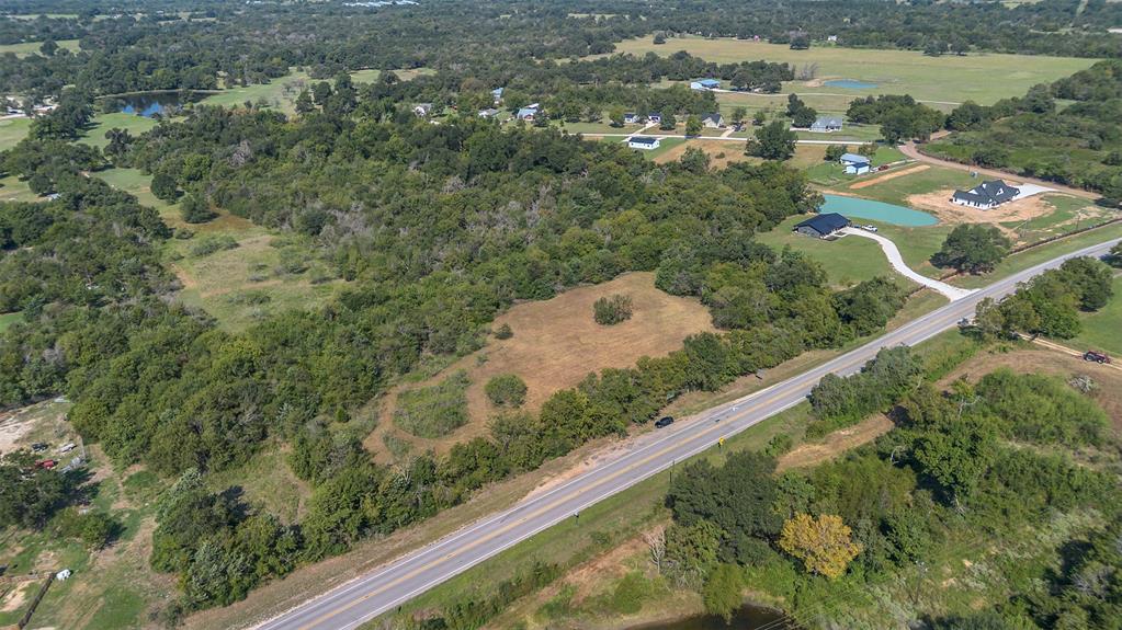 979 Rd Franklin Tx 77856 Road Franklin, TX 77856 - Photo 4 of 6 an aerial view of residential houses with outdoor space and trees