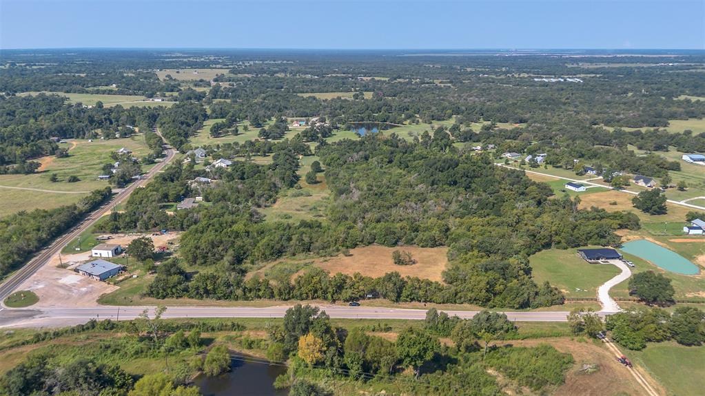 979 Rd Franklin Tx 77856 Road Franklin, TX 77856 - Photo 5 of 6 an aerial view of residential houses with outdoor space and trees