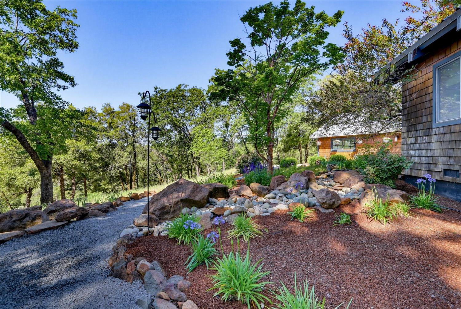 20111 Tanglewood Road Grass Valley, CA 95945 - Photo 82 of 93 a backyard of a house with lots of green space