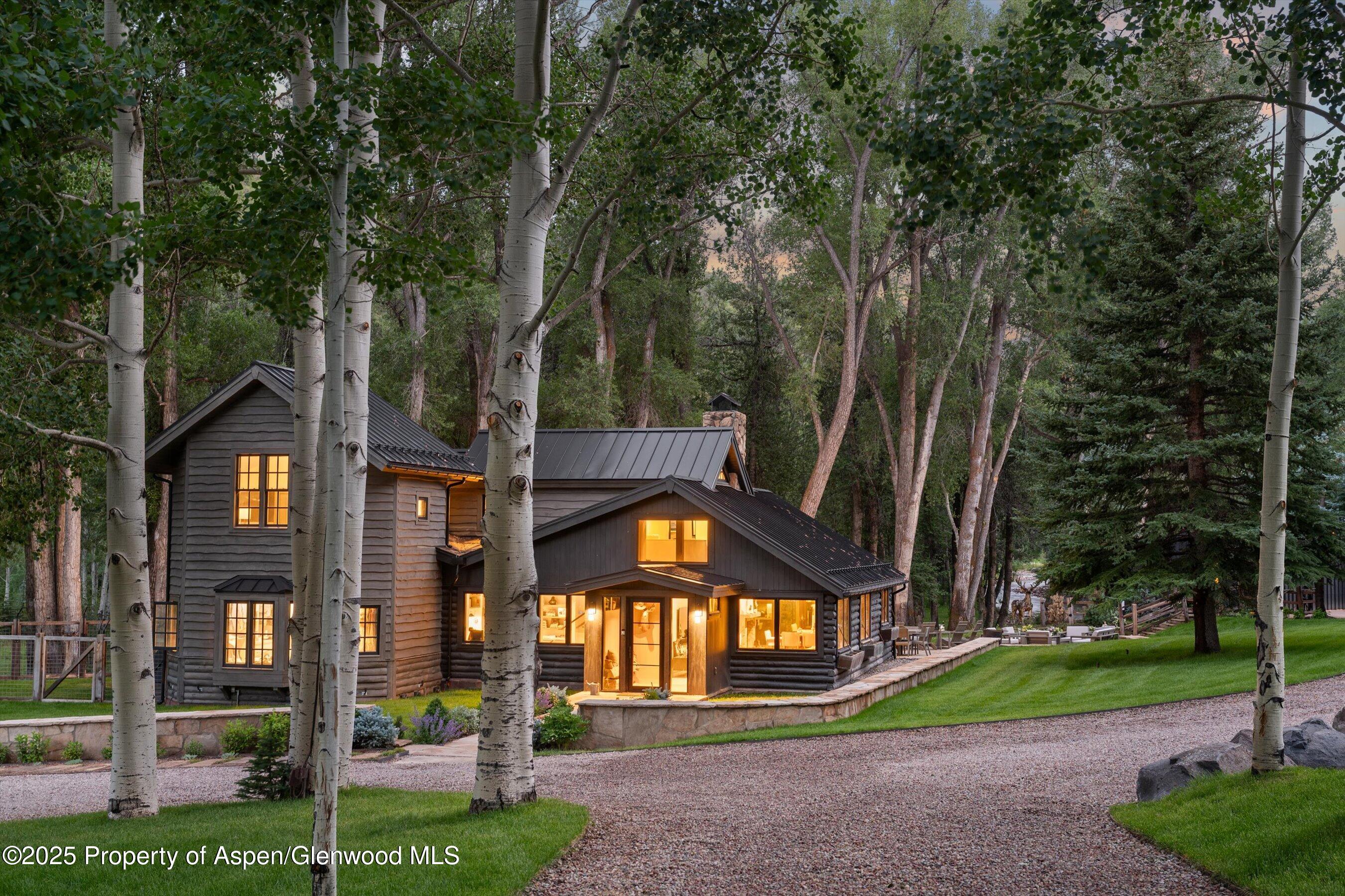 6458 Snowmass Creek Road Snowmass, CO 81654 - Photo 19 of 114 a front view of a house with a yard
